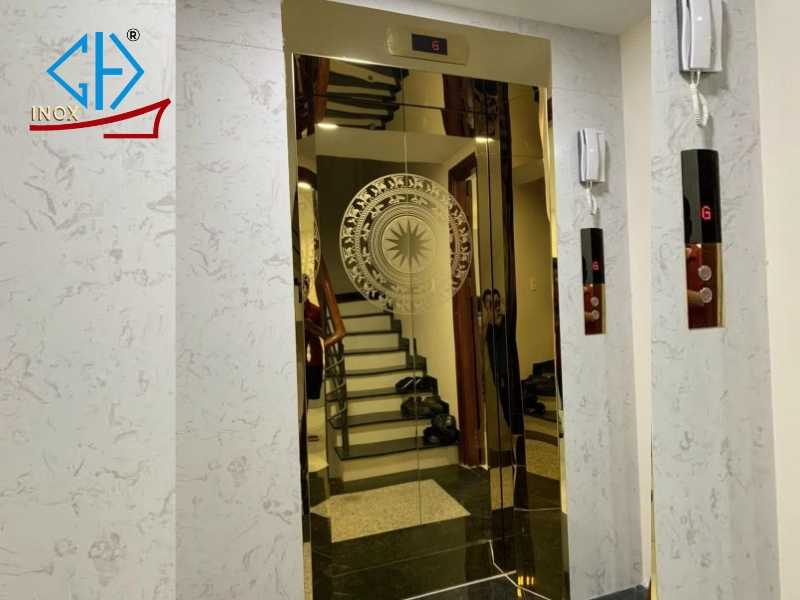 Cửa thang máy inox hoa văn trống đồng sang trọng